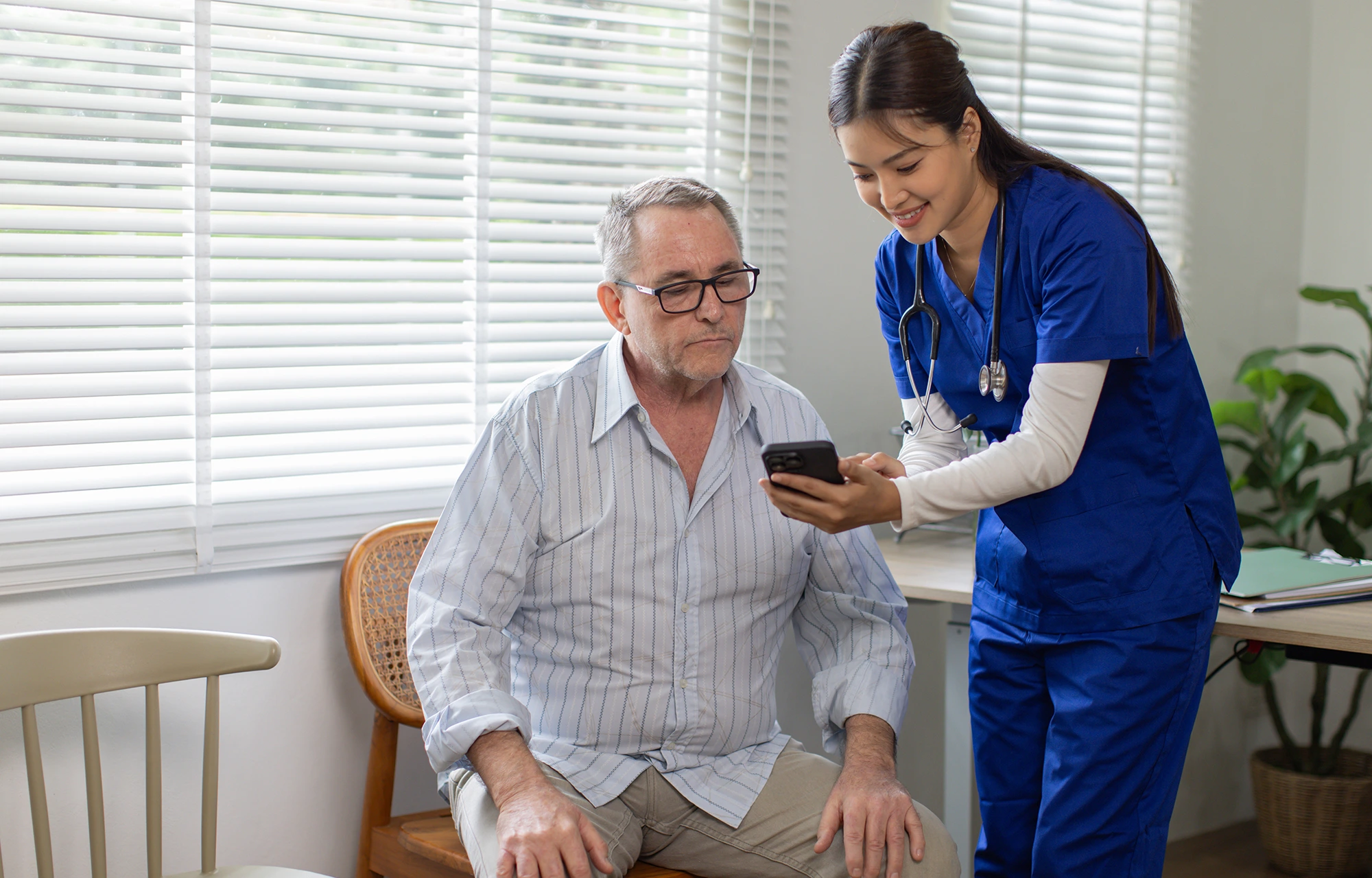 Therapist guiding a patient through TBI cognitive rehabilitation exercises to improve memory, attention, concentration, and problem-solving skills after a traumatic brain injury.
