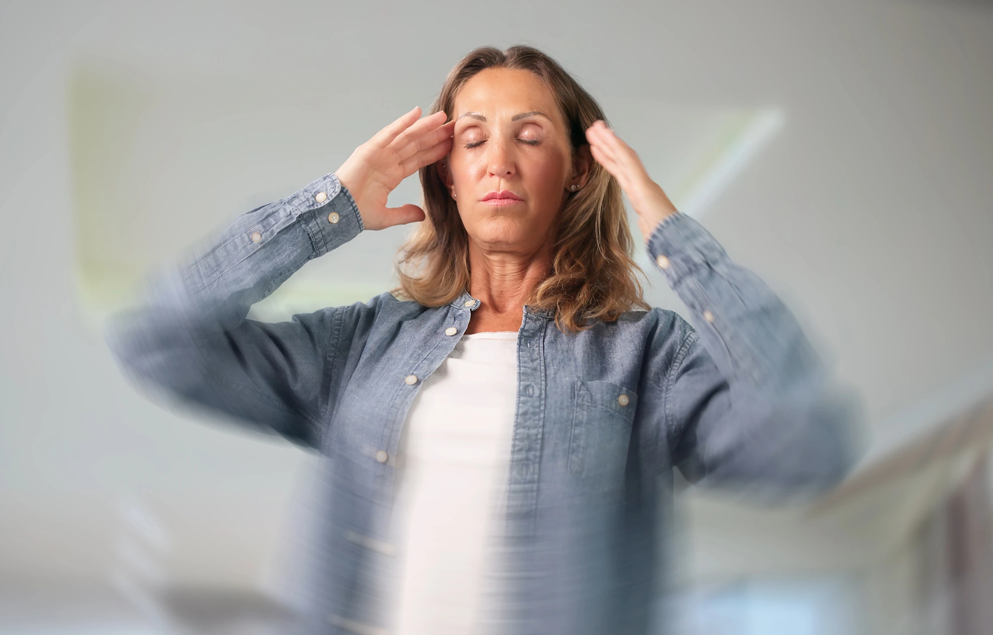 Physical therapist guiding a patient through TBI vestibular therapy exercises to improve balance, gaze stability, and dizziness after a traumatic brain injury.